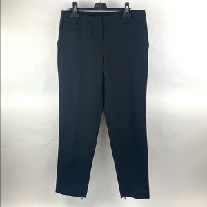 Cropped black trousers with ankle zippers